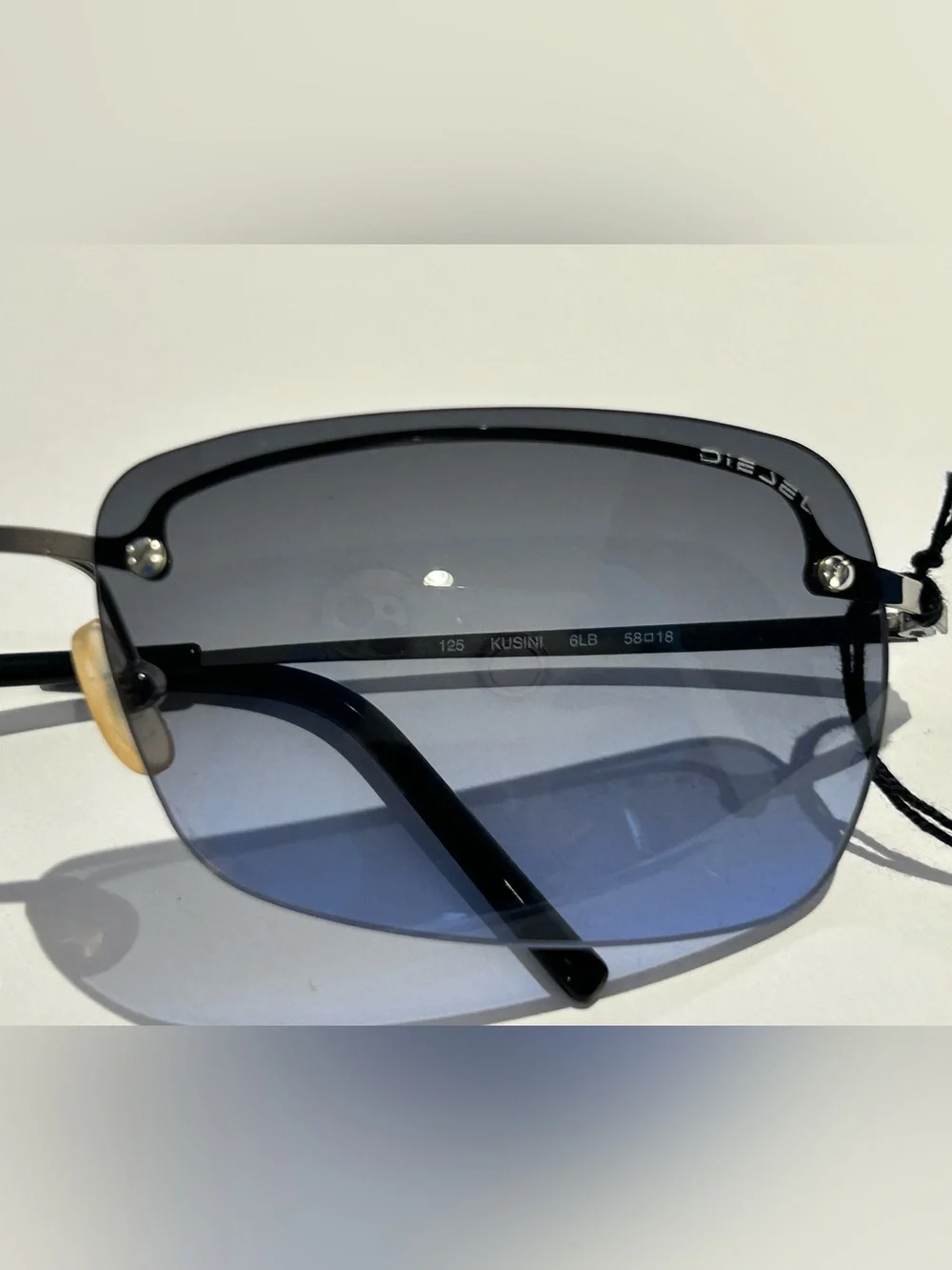 Diesel Gunmetal Frame Blue Gradient Lens Rimless Sunglasses -Kusini
